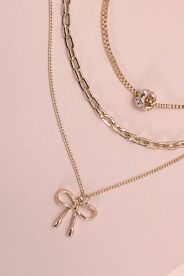 MULTI LAYER PEARL BOW CHARM NECKLACE | 80N605