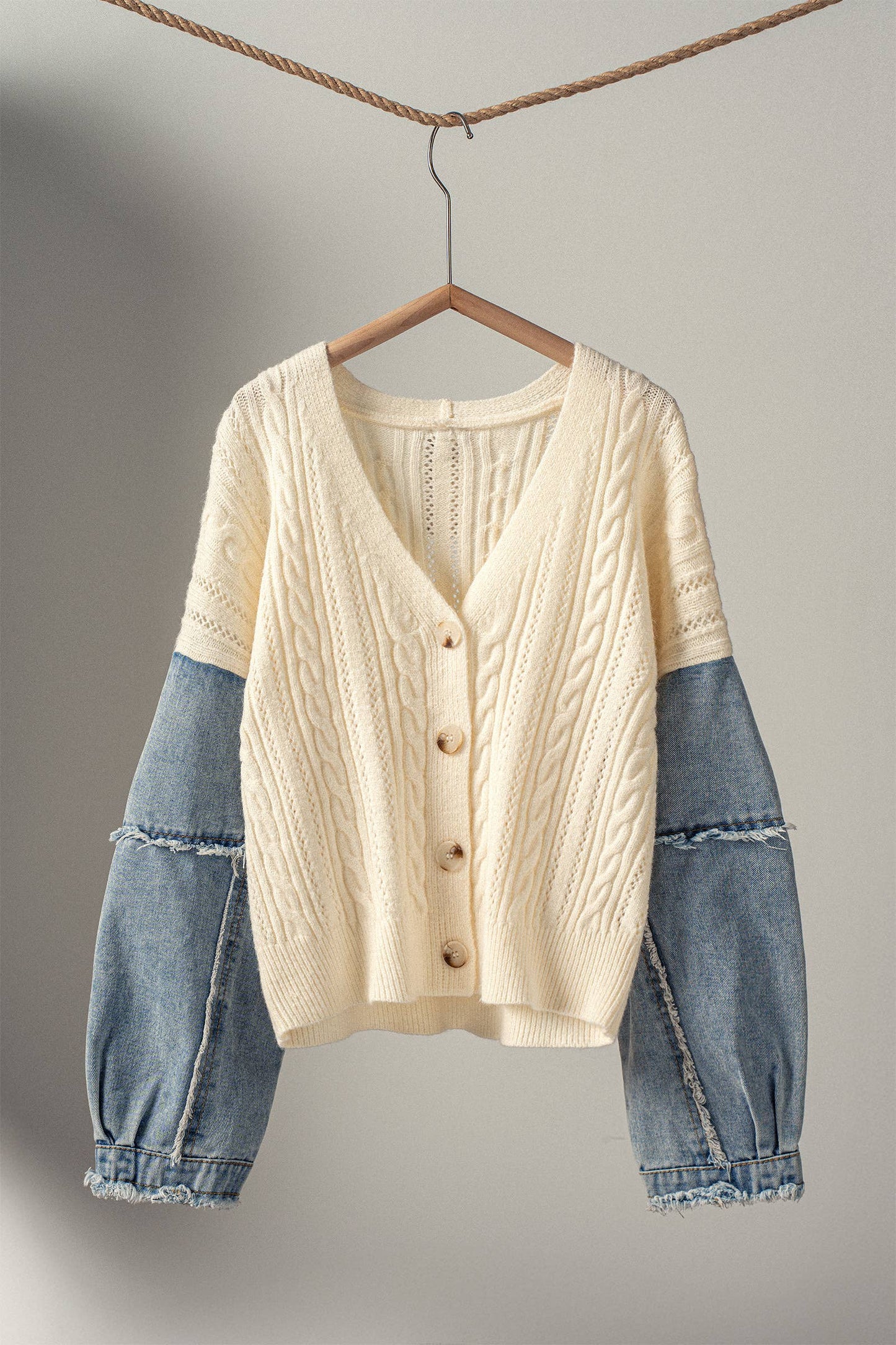 FRAYED DENIM SLEEVE CABLE KNIT CARDIGAN