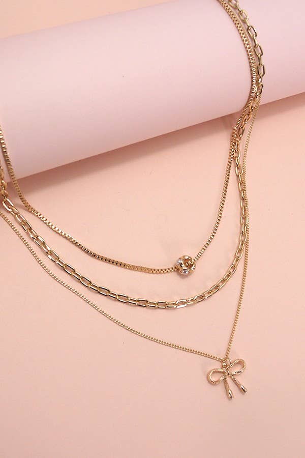 MULTI LAYER PEARL BOW CHARM NECKLACE | 80N605
